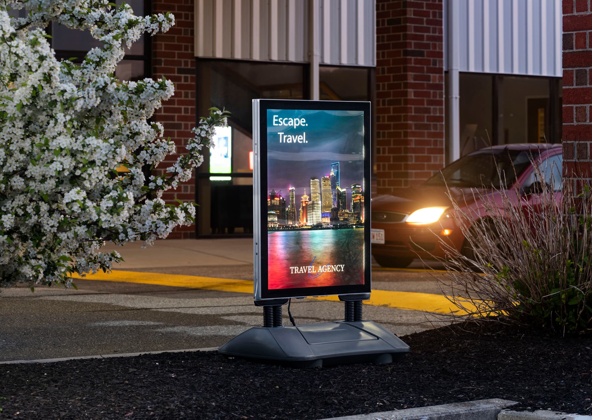LED illuminated sidewalk sign with variable brightness modes