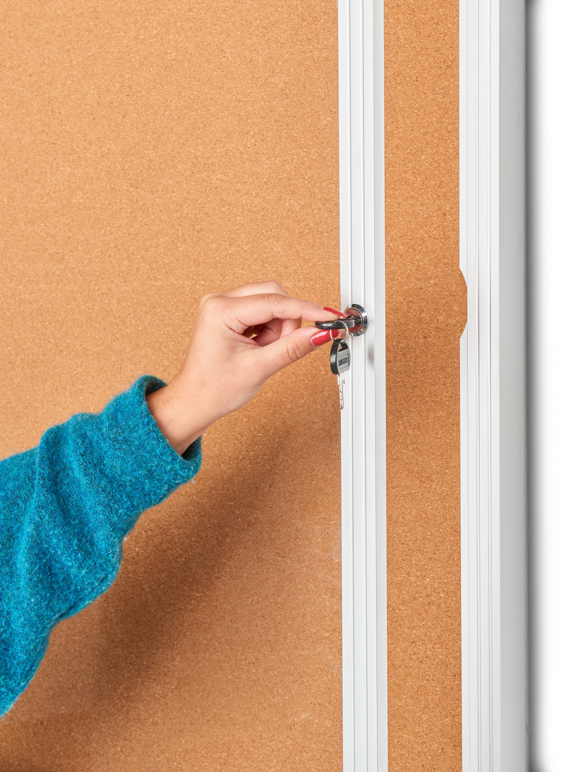 This enclosed aluminum bulletin board has locking latch