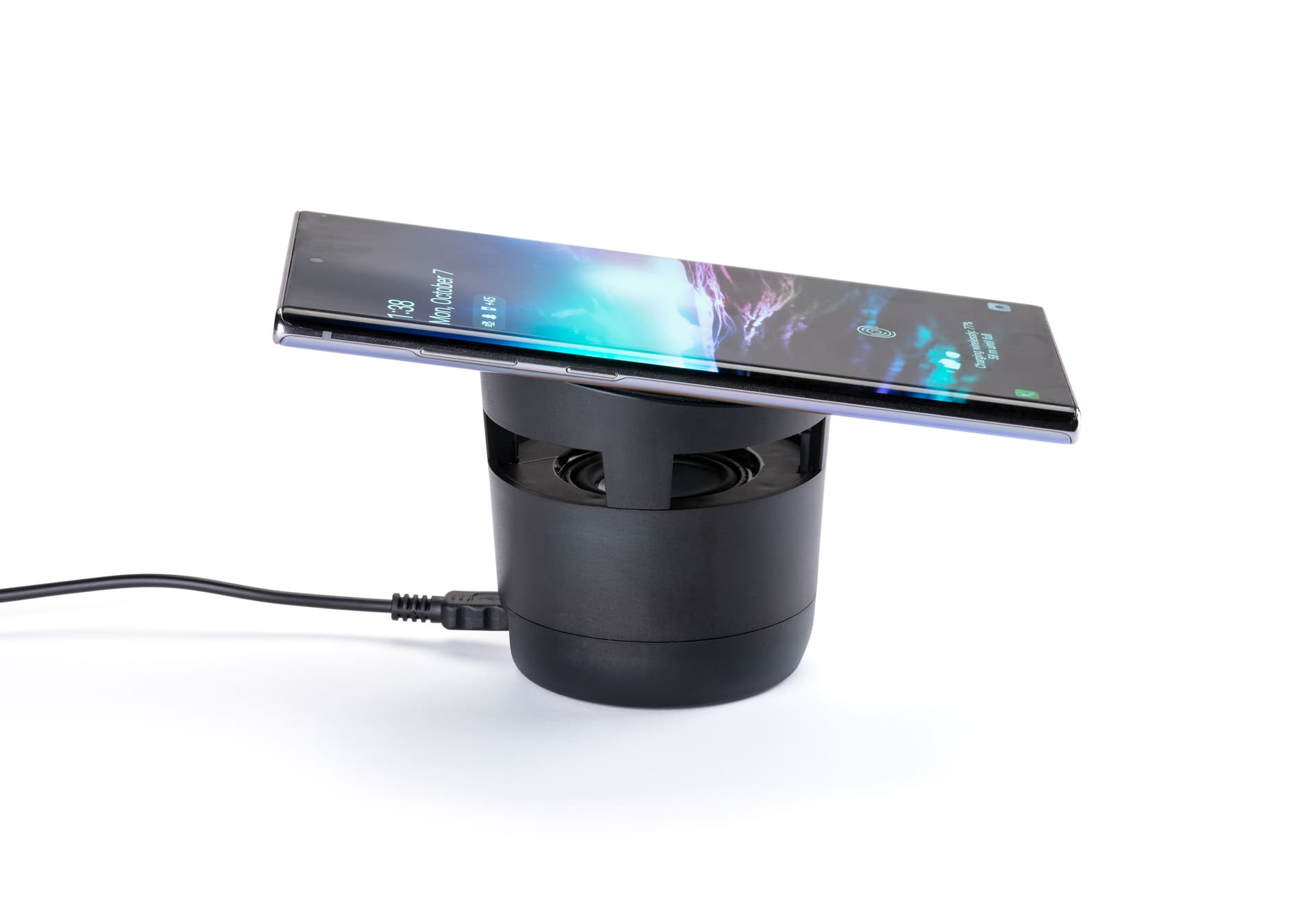 Black wireless charging speaker with non-slip powering platform and base