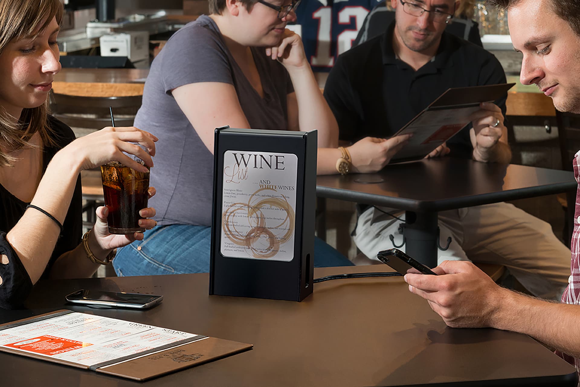 Restaurant menu power bank in use