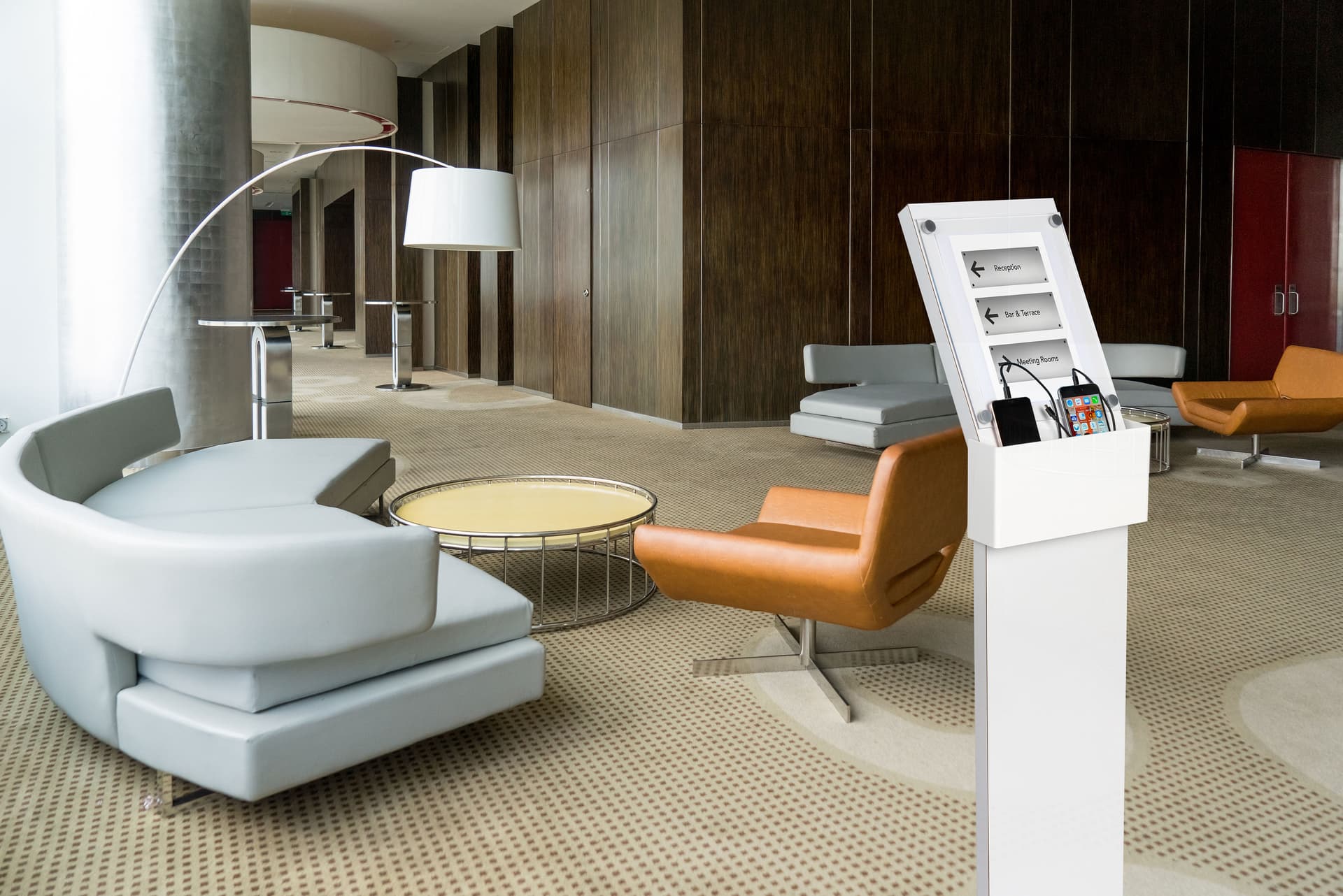white cell phone charging station with marketing insert