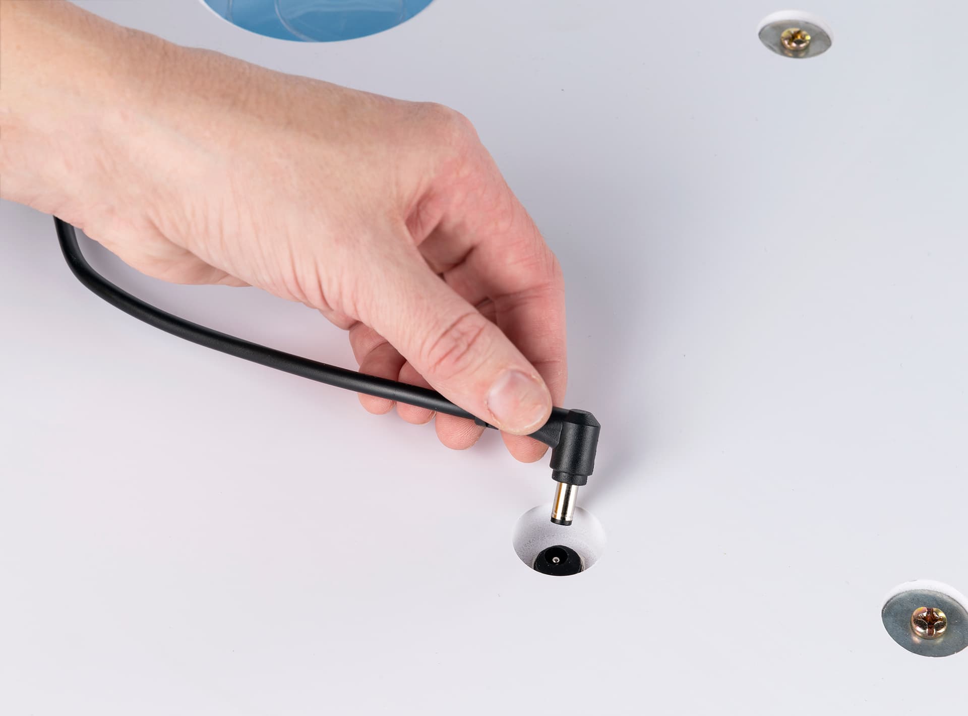 Connection to power supply on base of backlit inflatable tower