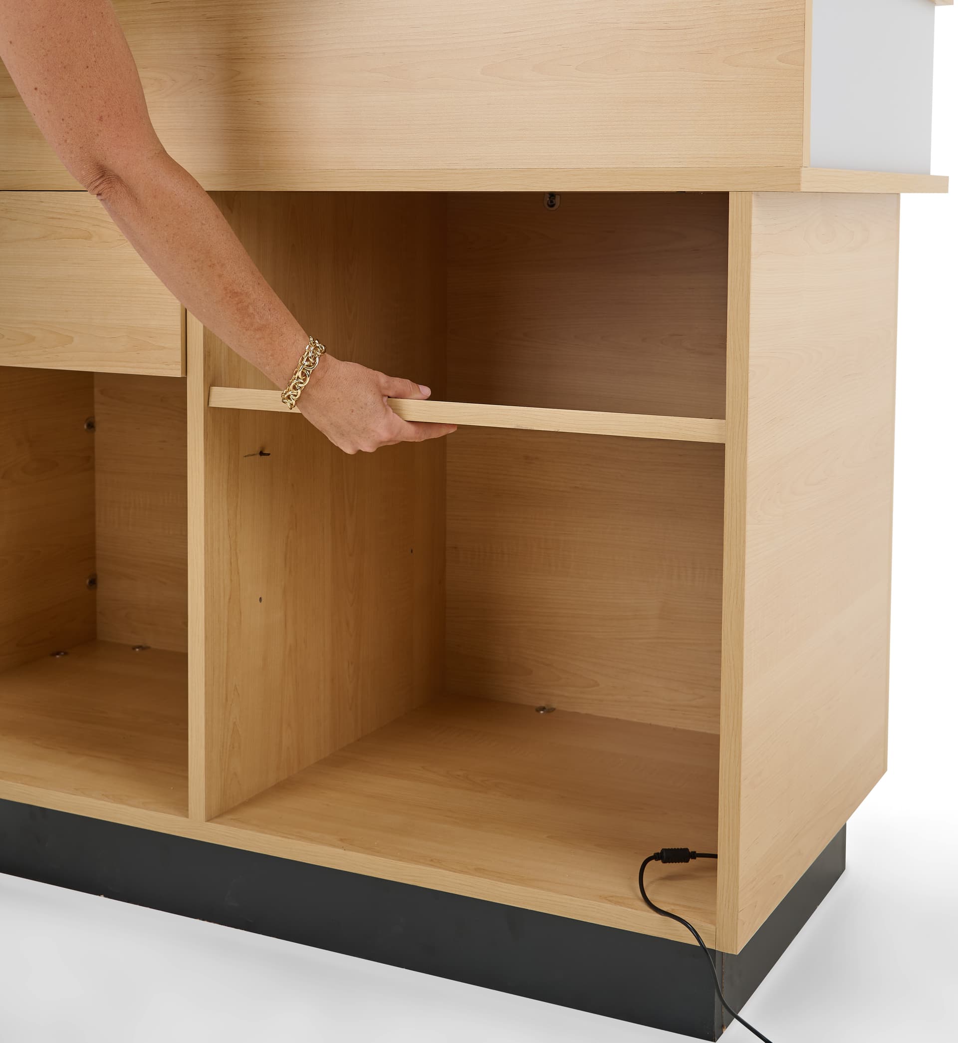 Retail cash wrap with LED lighting with adjustable shelf