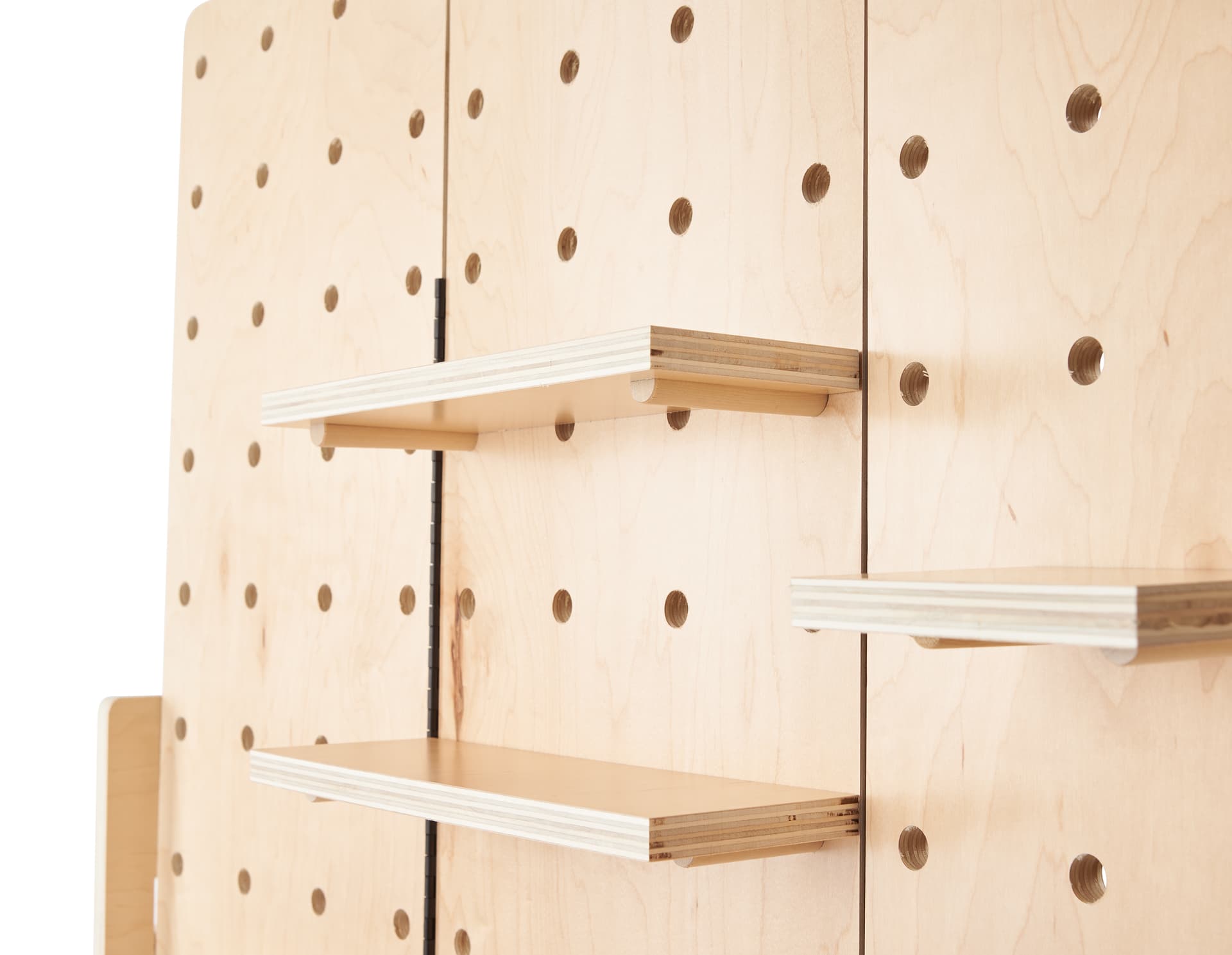 Wooden pegboard accessories with natural wood finish