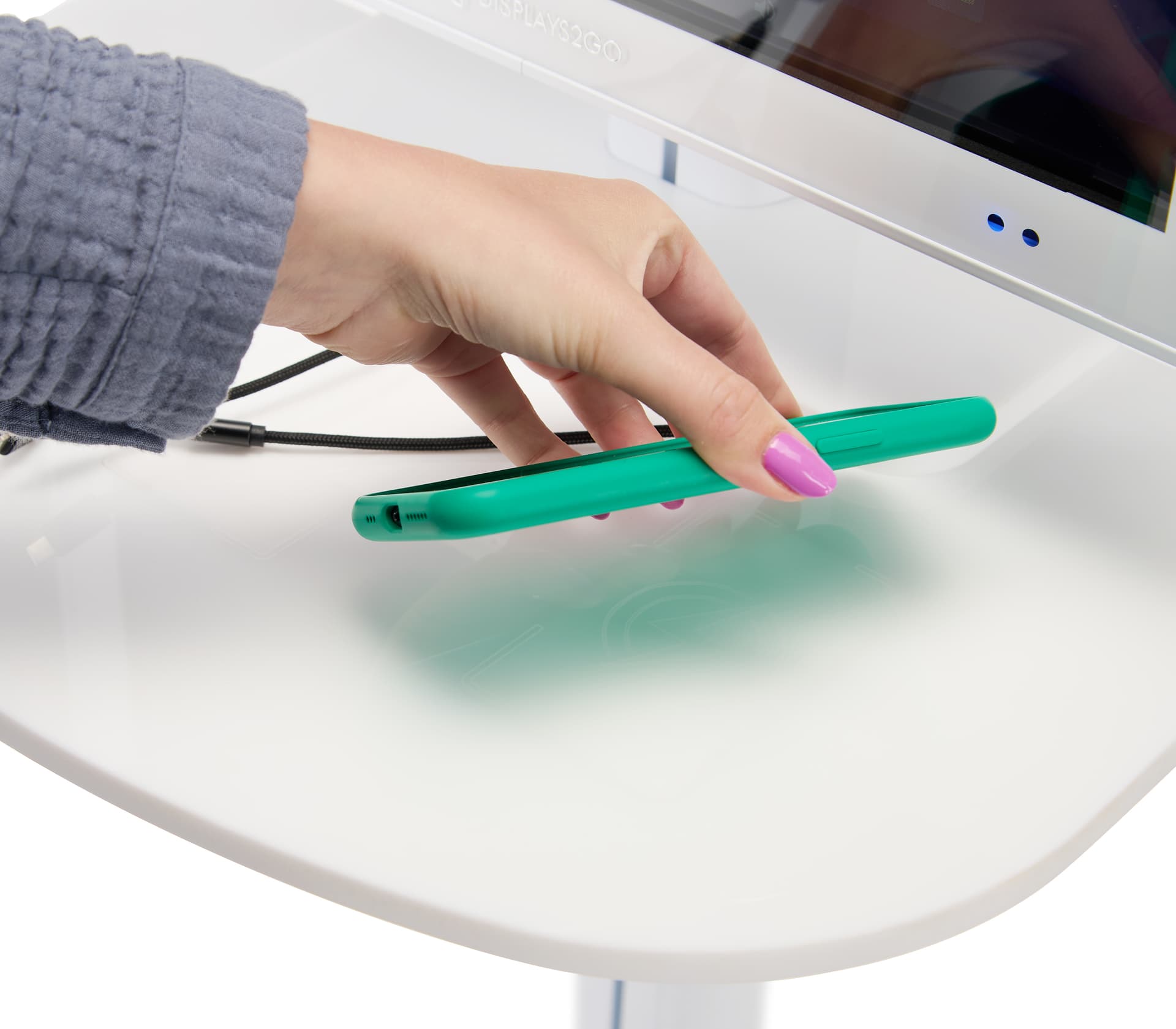 Digital charging station with a phone being placed on one of three wireless charging pads