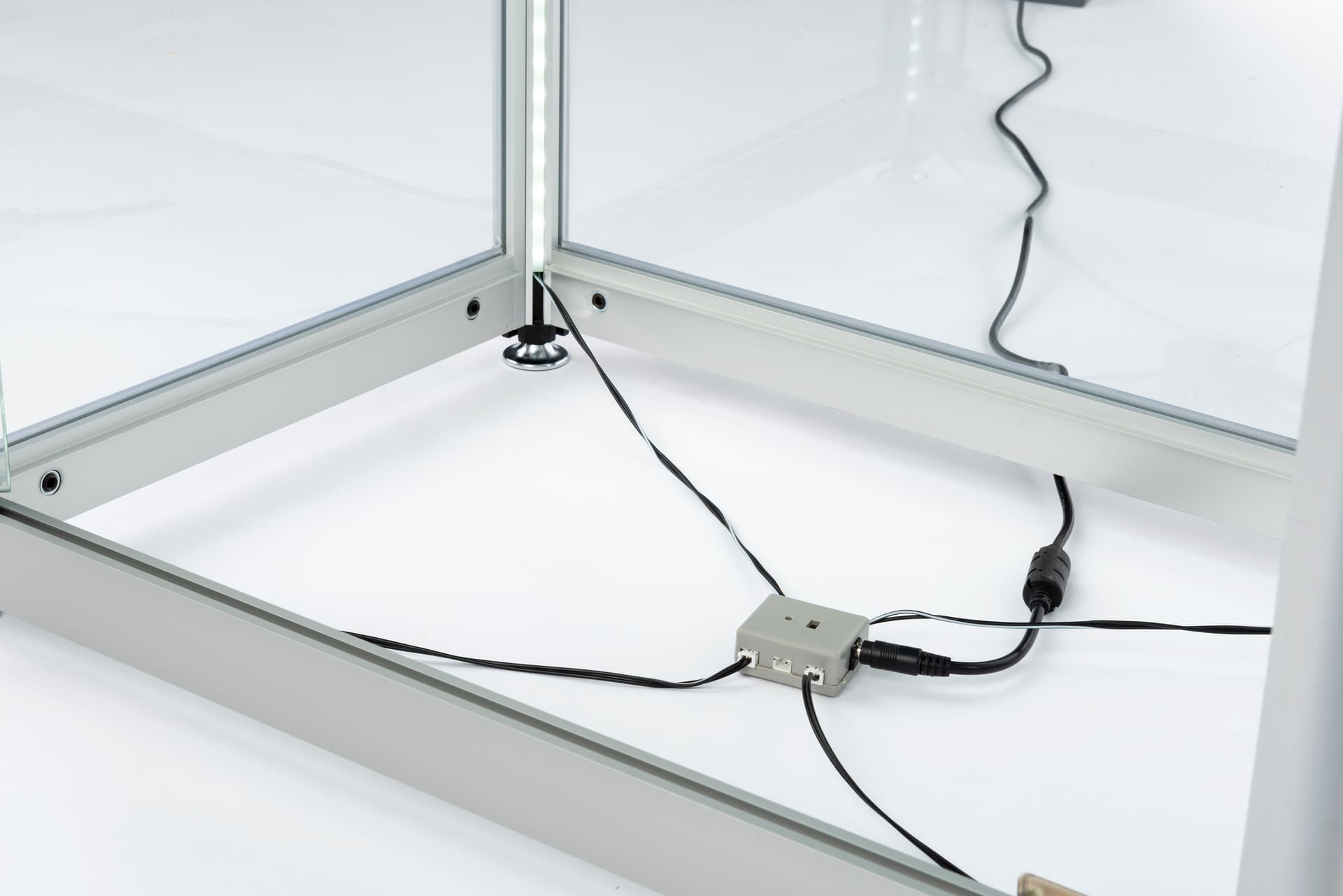 glass display tower power cord exit