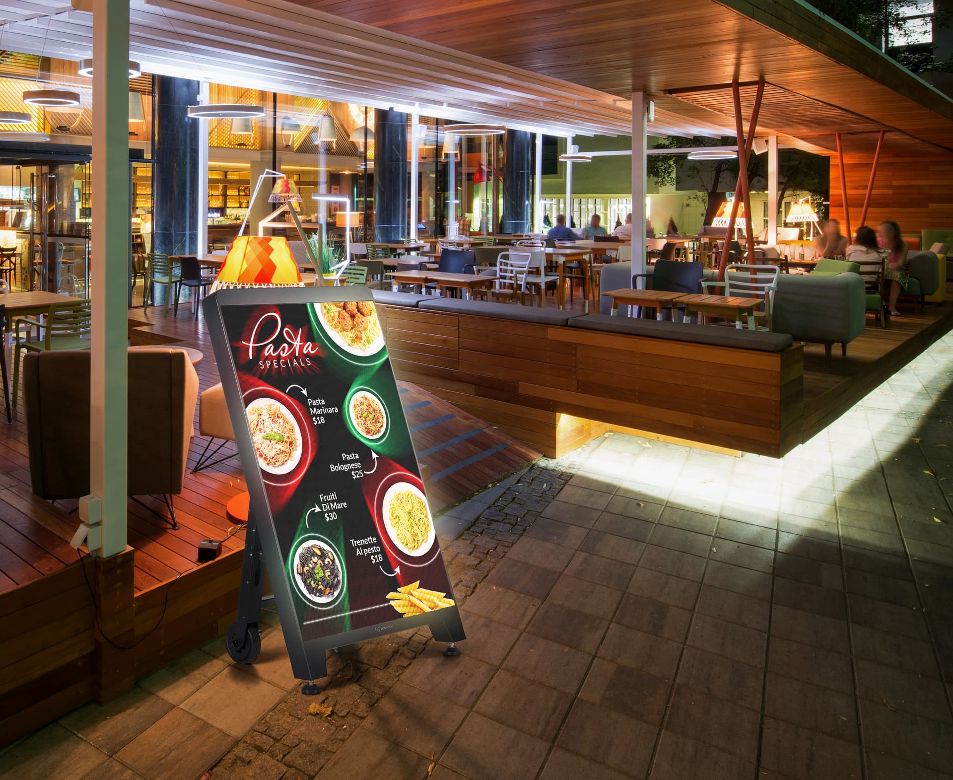 Digital sidewalk sign with the unit being showcased outside a restaurant environment exhibiting pasta specials