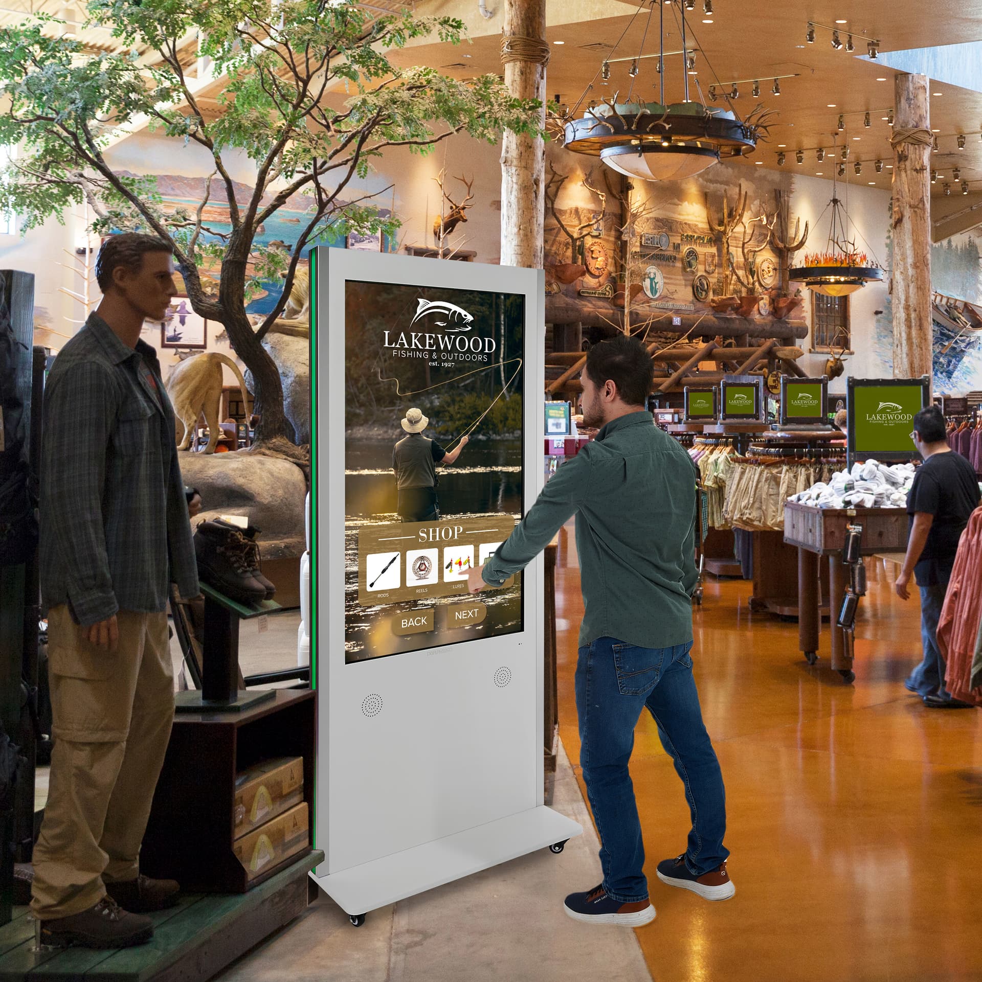 Interactive Digital Display with a unit being displayed in a store where customers can also browse sites via there digital signage units