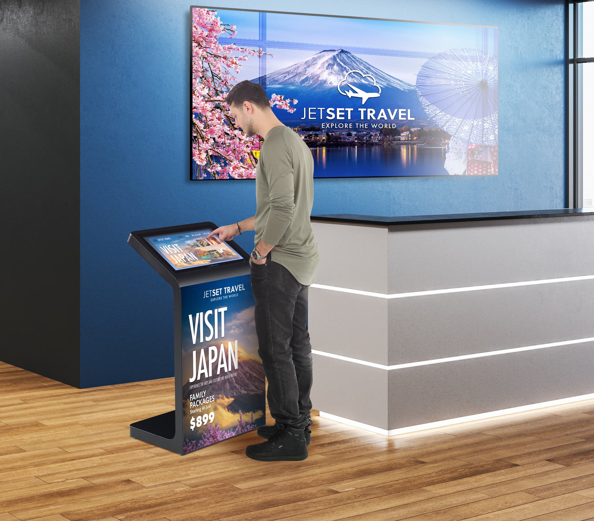 Floor standing touch screen kiosk being utilized in a travel agency environment