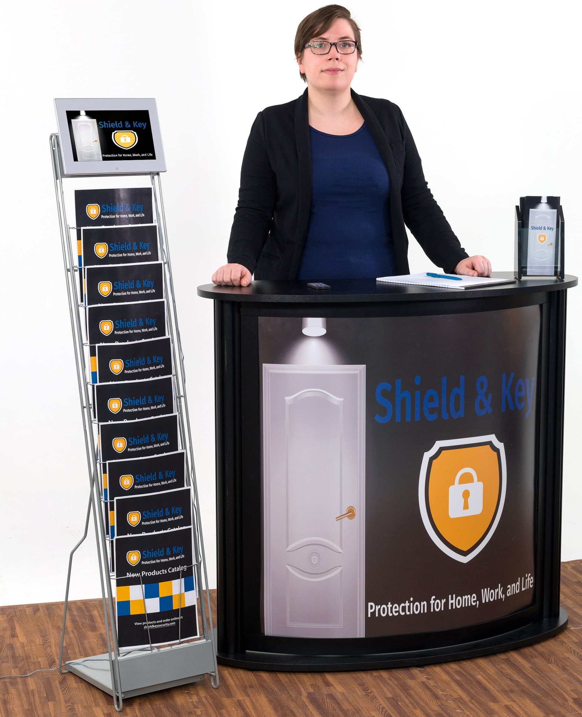 Digital signage video literature rack shown in trade show booth