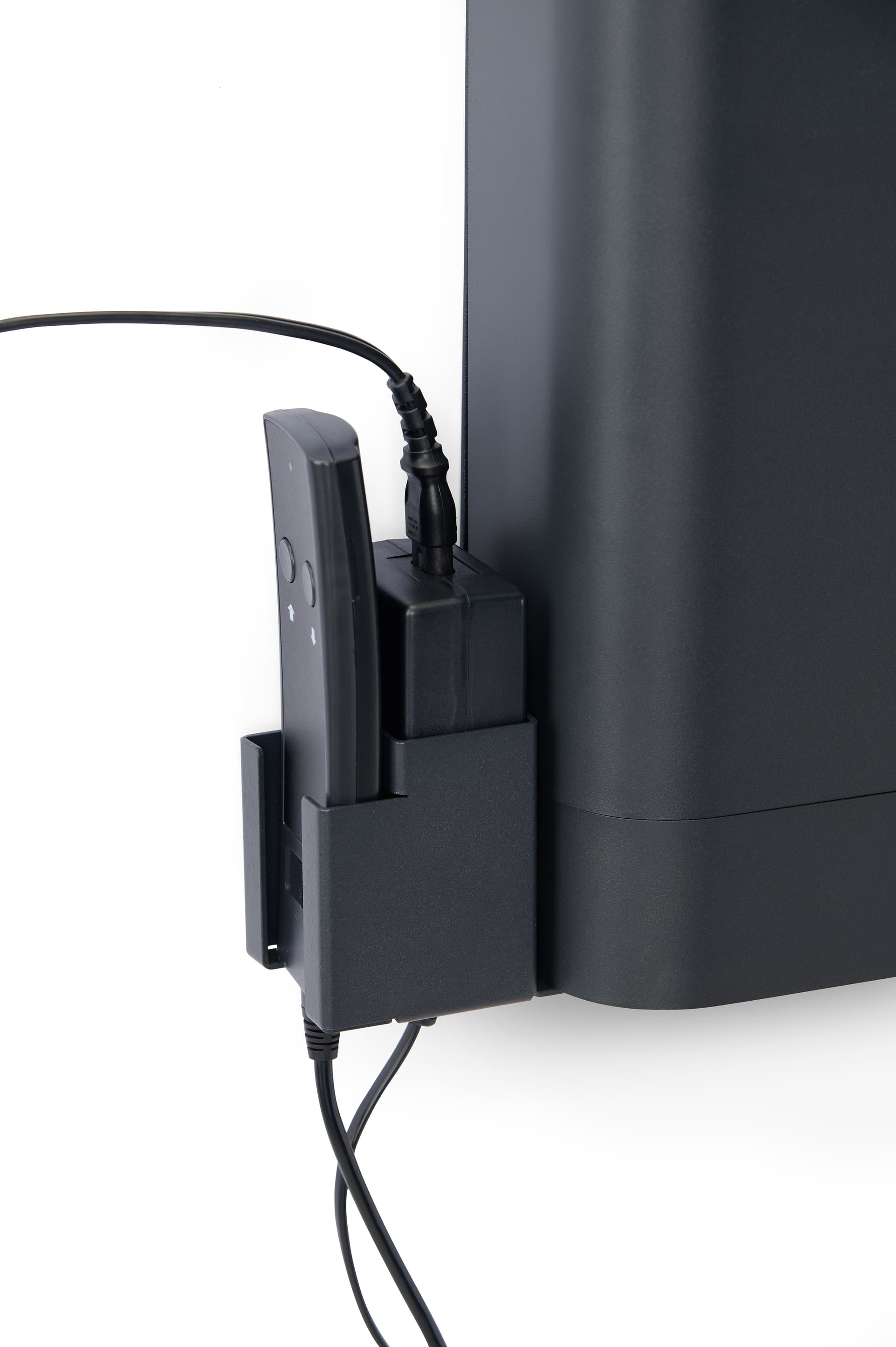 Motorized TV wall mount includes a remote holder for the wired option