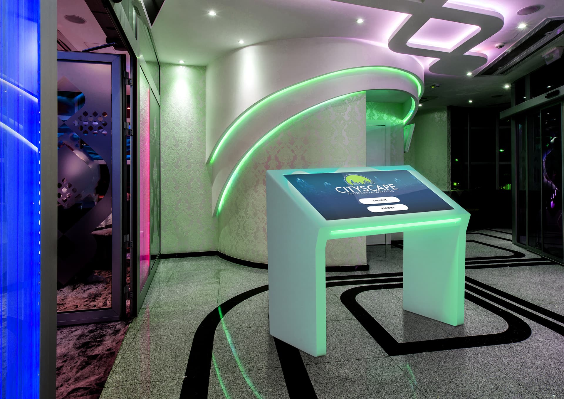 Edge lit horizontal touch screen kiosk in low-lit business lobby