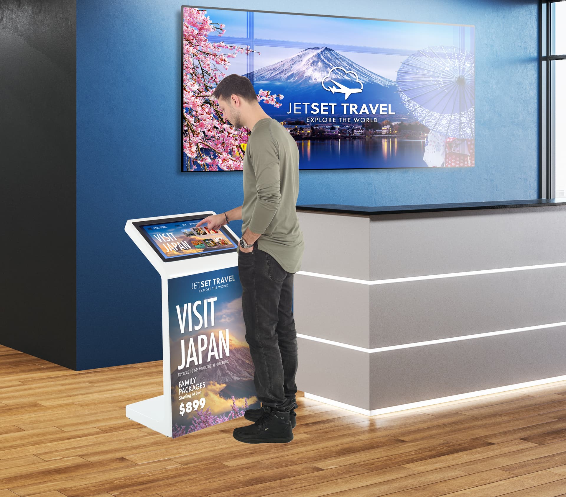 Floor standing touch screen kiosk being used in an airport check in space
