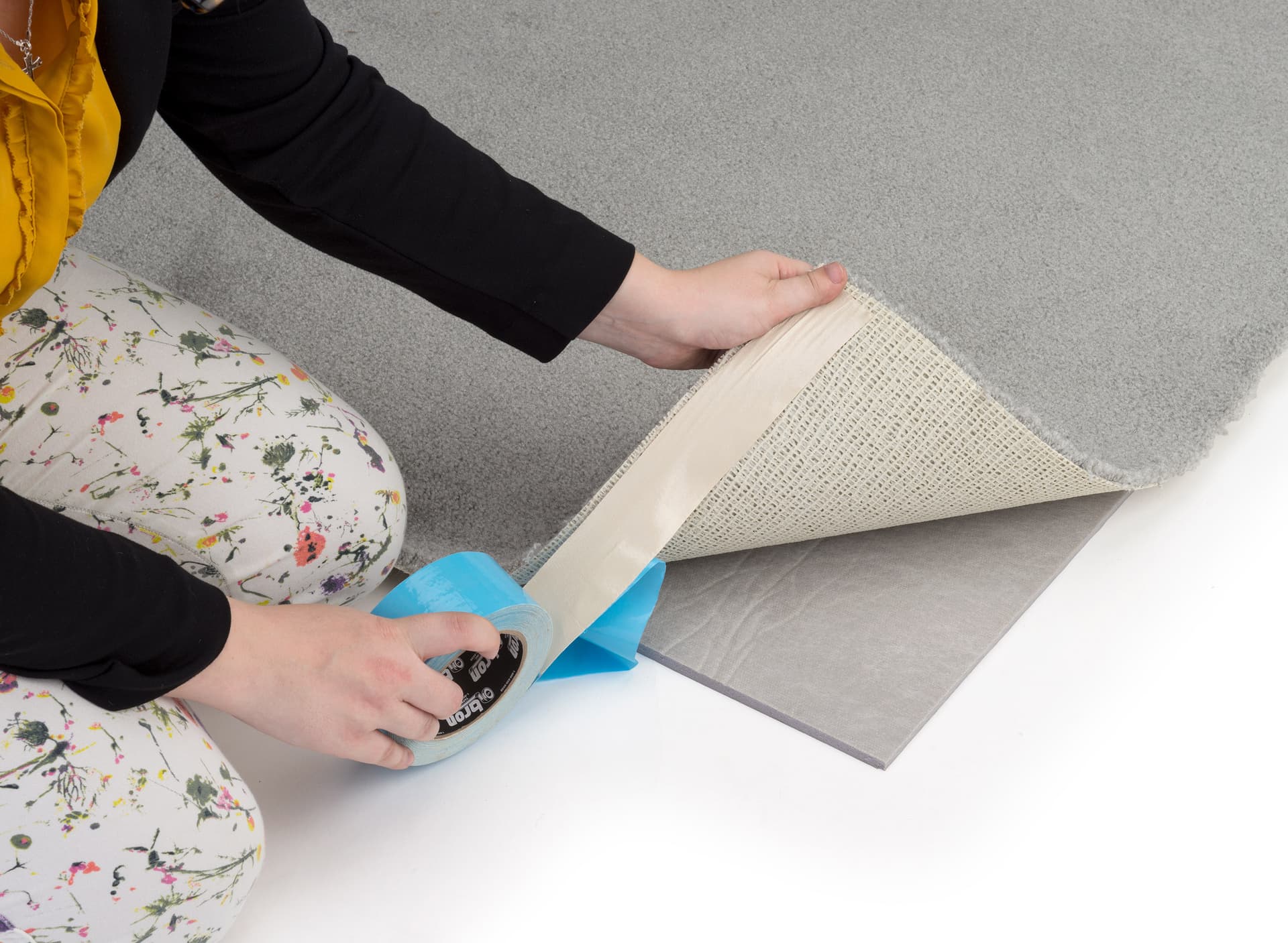 Removable carpet tape shown with flooring