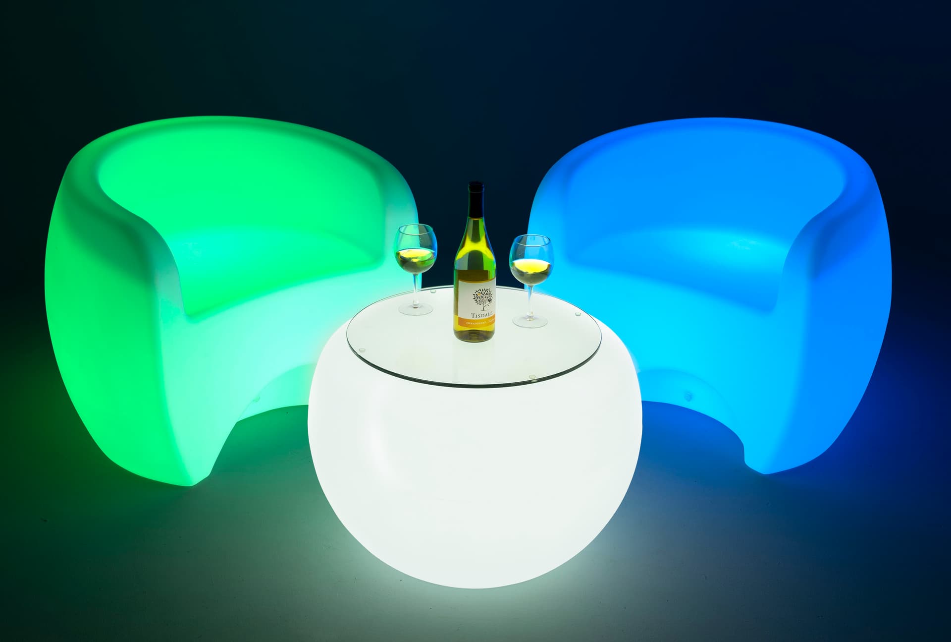 LED round coffee table complimented wtih u-shaped illuminated chairs