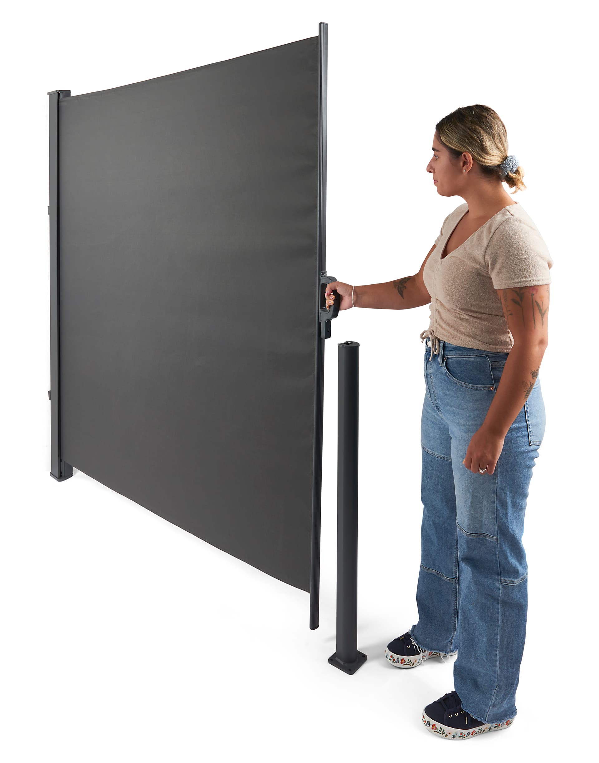 Retractable outdoor privacy divider extends quickly and easily 