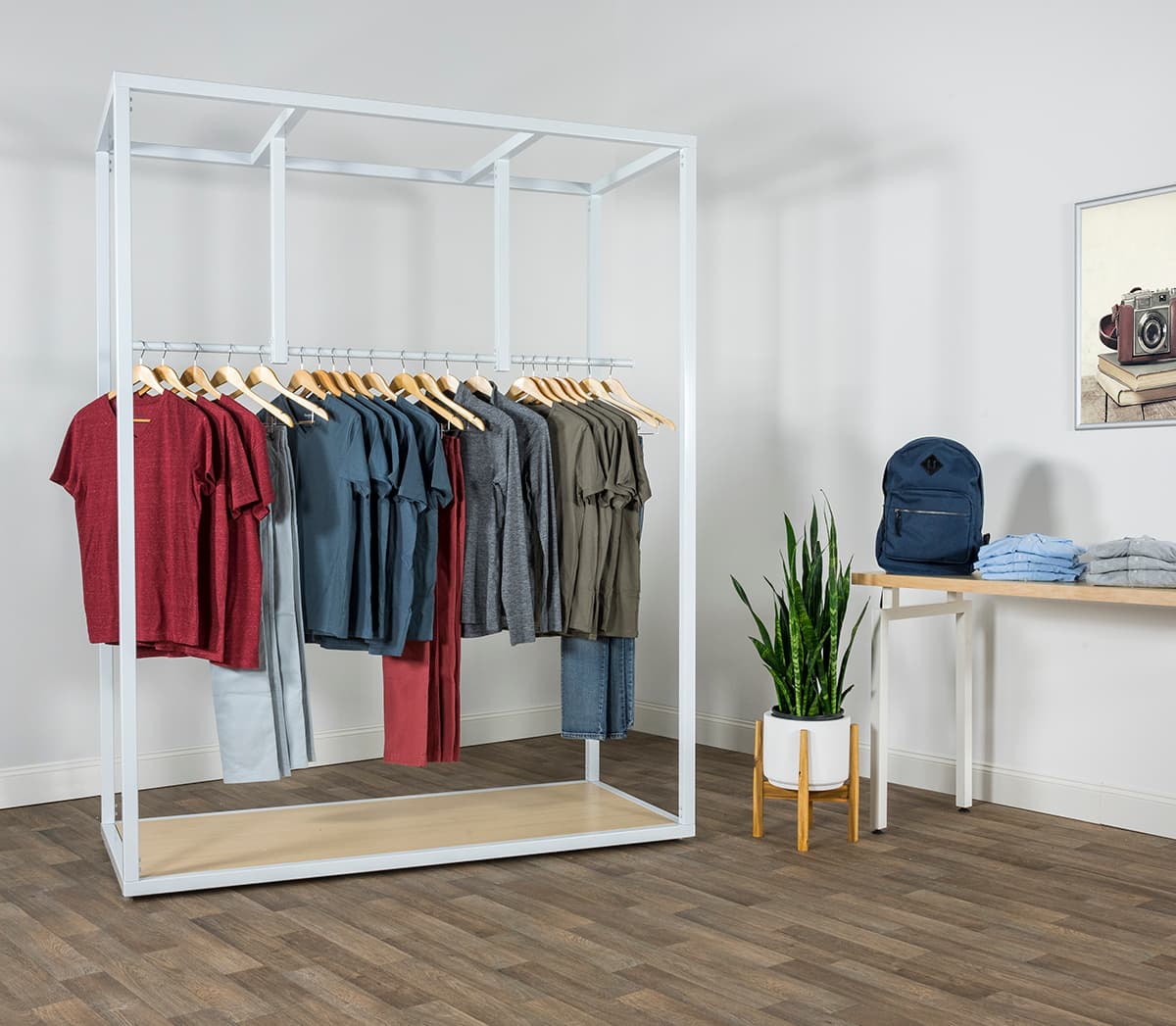 White boutique floor clothing hanger display