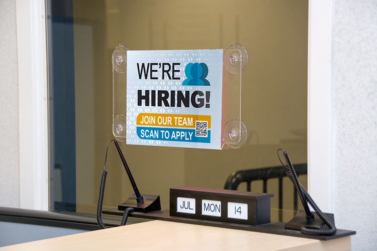 Window sign holder can hold two graphics