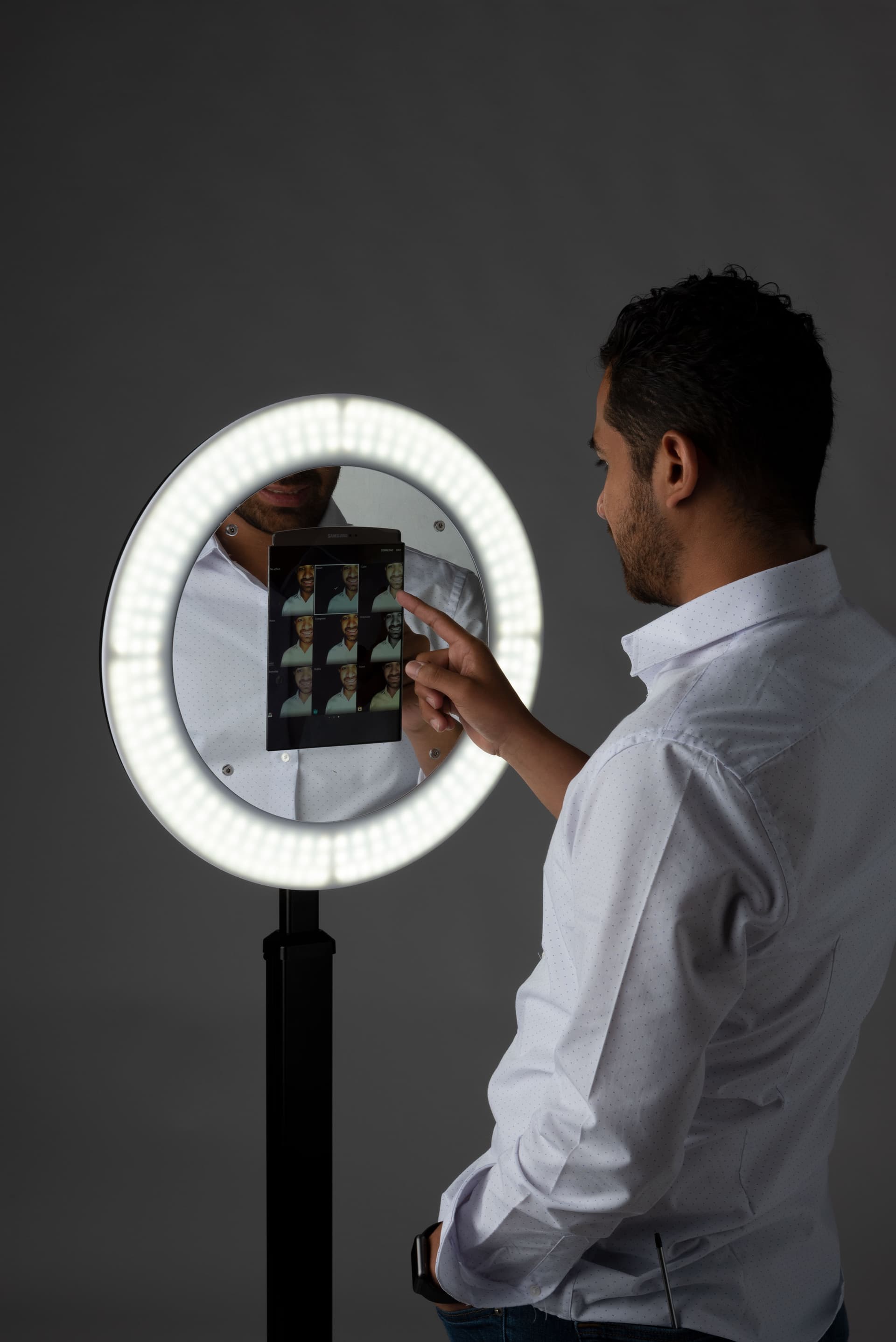 iPad photo booth stand with light ring enclosure for event selfies