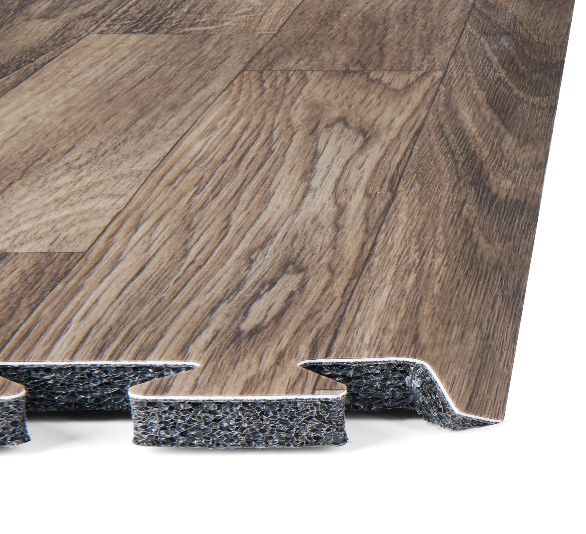 Trade show booth flooring exhibiting the layering of foam, vinyl finish, and beveled edge of one square