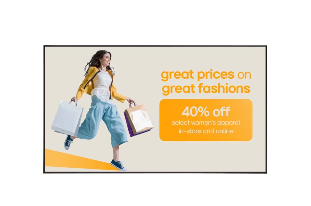 Digital advertising screen showcasing a retail clothing store sale graphic 