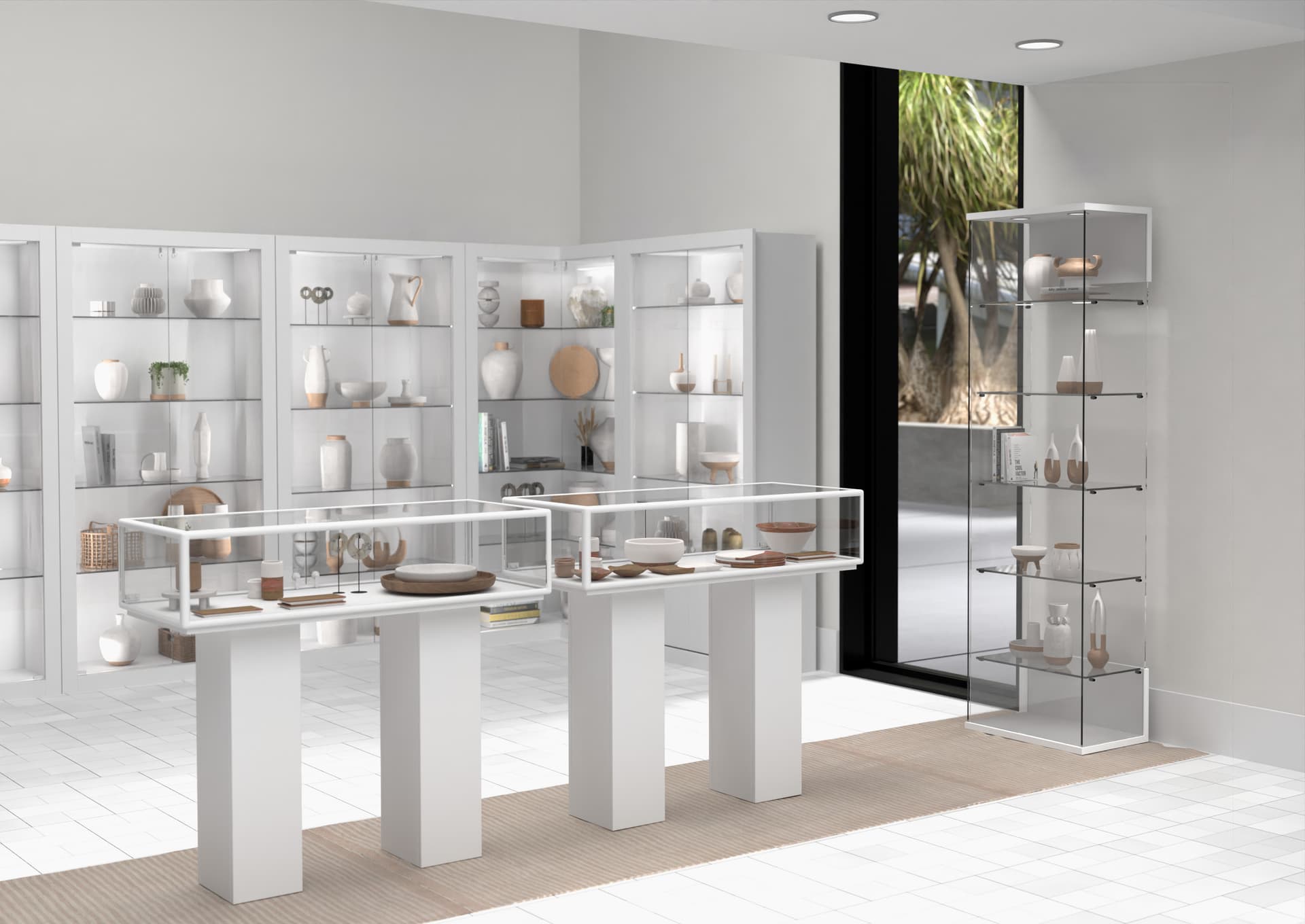 Glass curio cabinet paired with other display cases of our Opulent collection in a retail environment