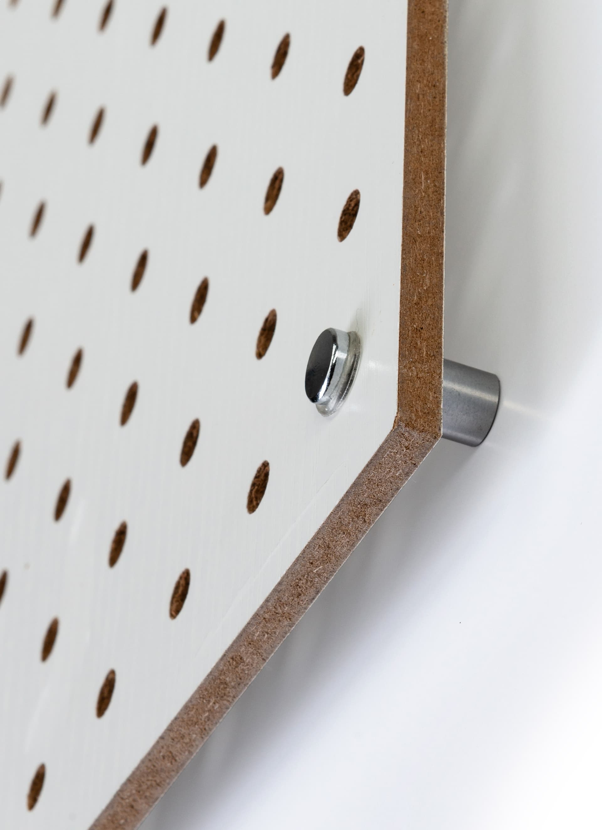 Large white pegboard with silver standoffs