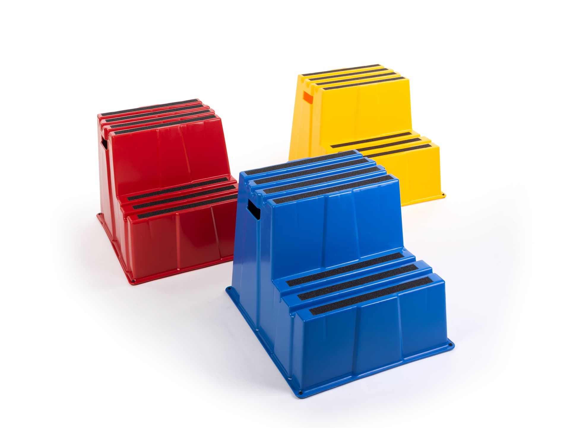 Three Industrial step stands in bright colors