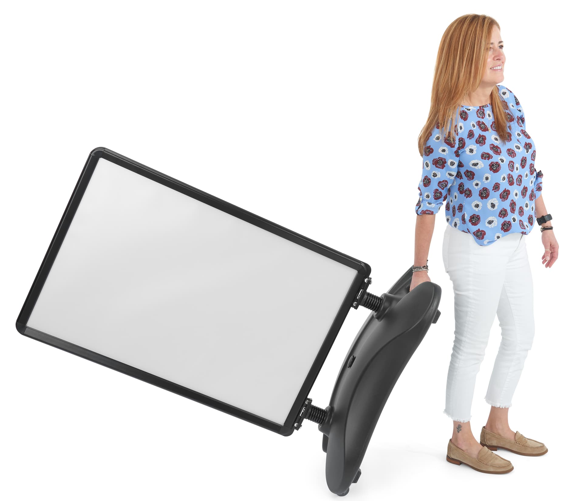 Free standing sign shown being pulled by an individual by its built-in handles and rolling wheels