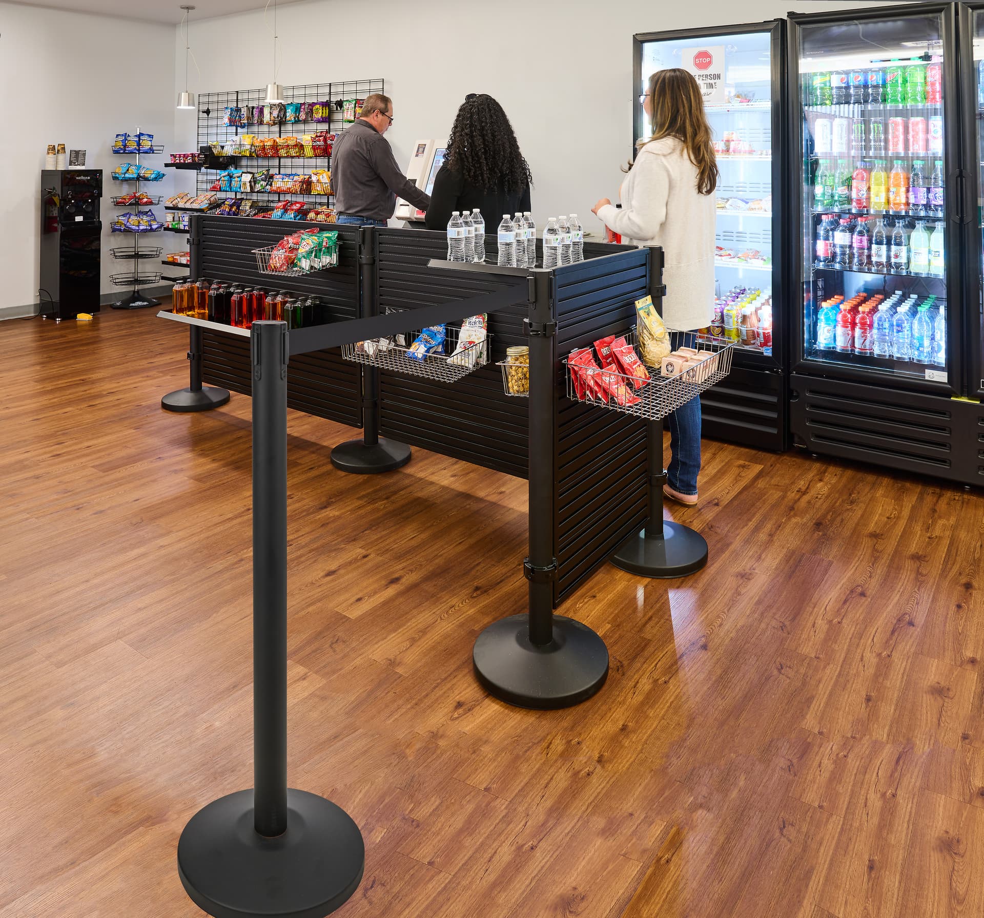Slatwall merchandiser for queue lines