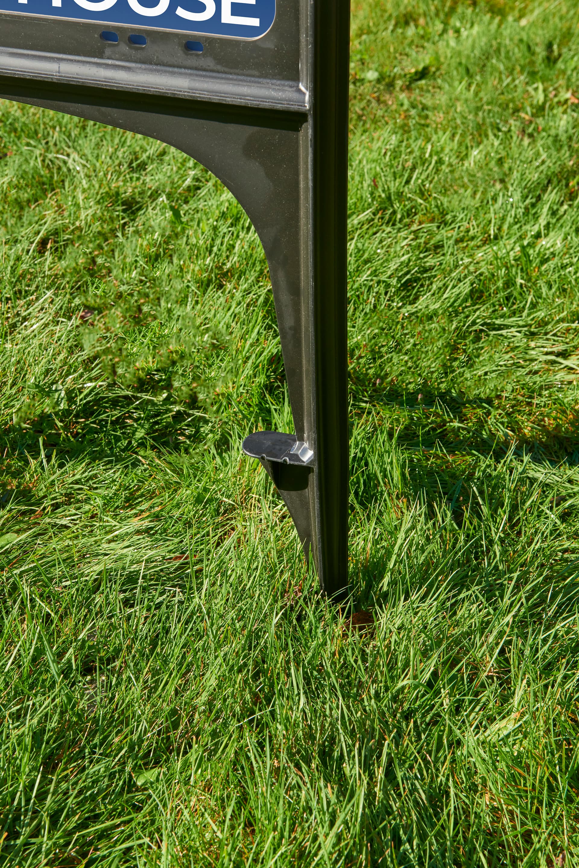 Black plastic real estate sign stands for ground insert 