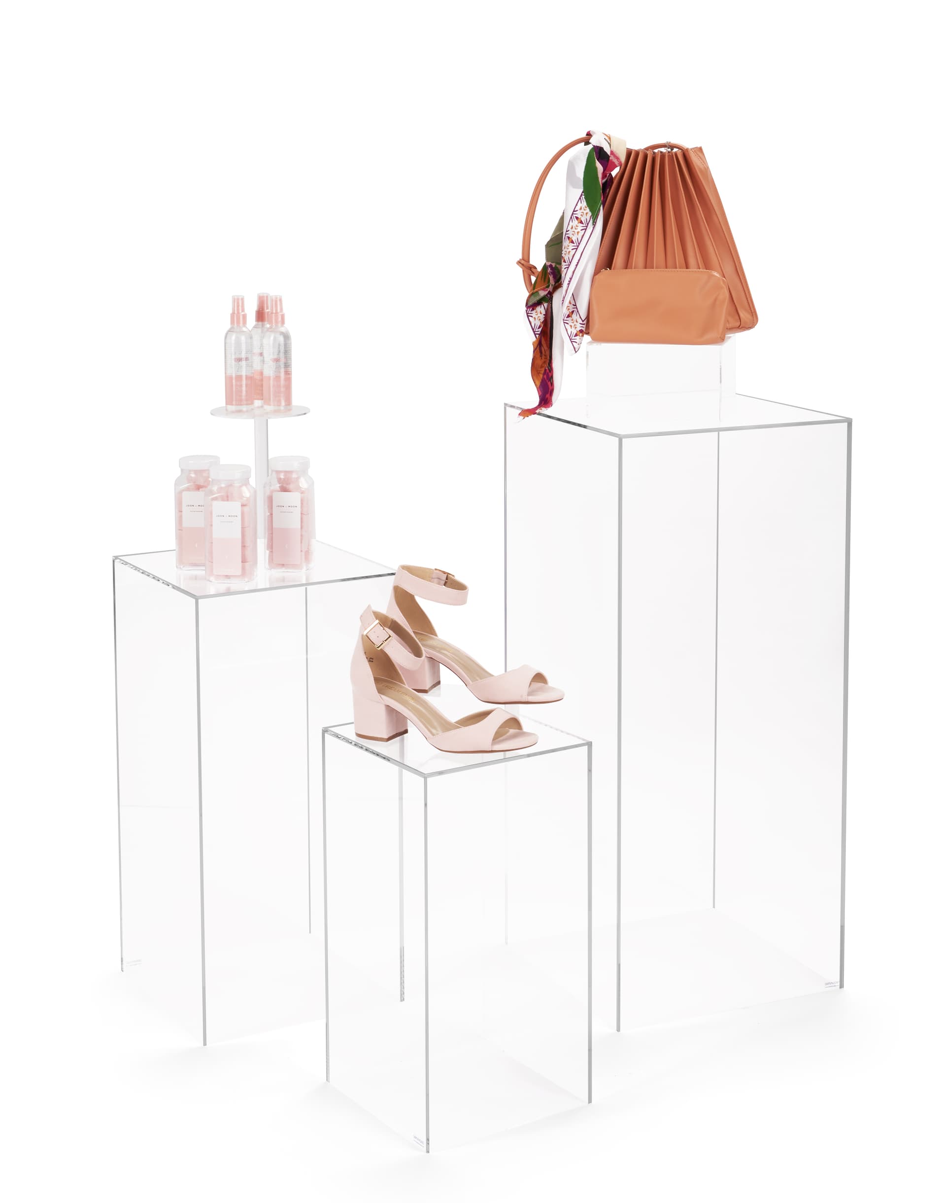 Clear nested display pedestal set with max weight capacity of 35 pounds each