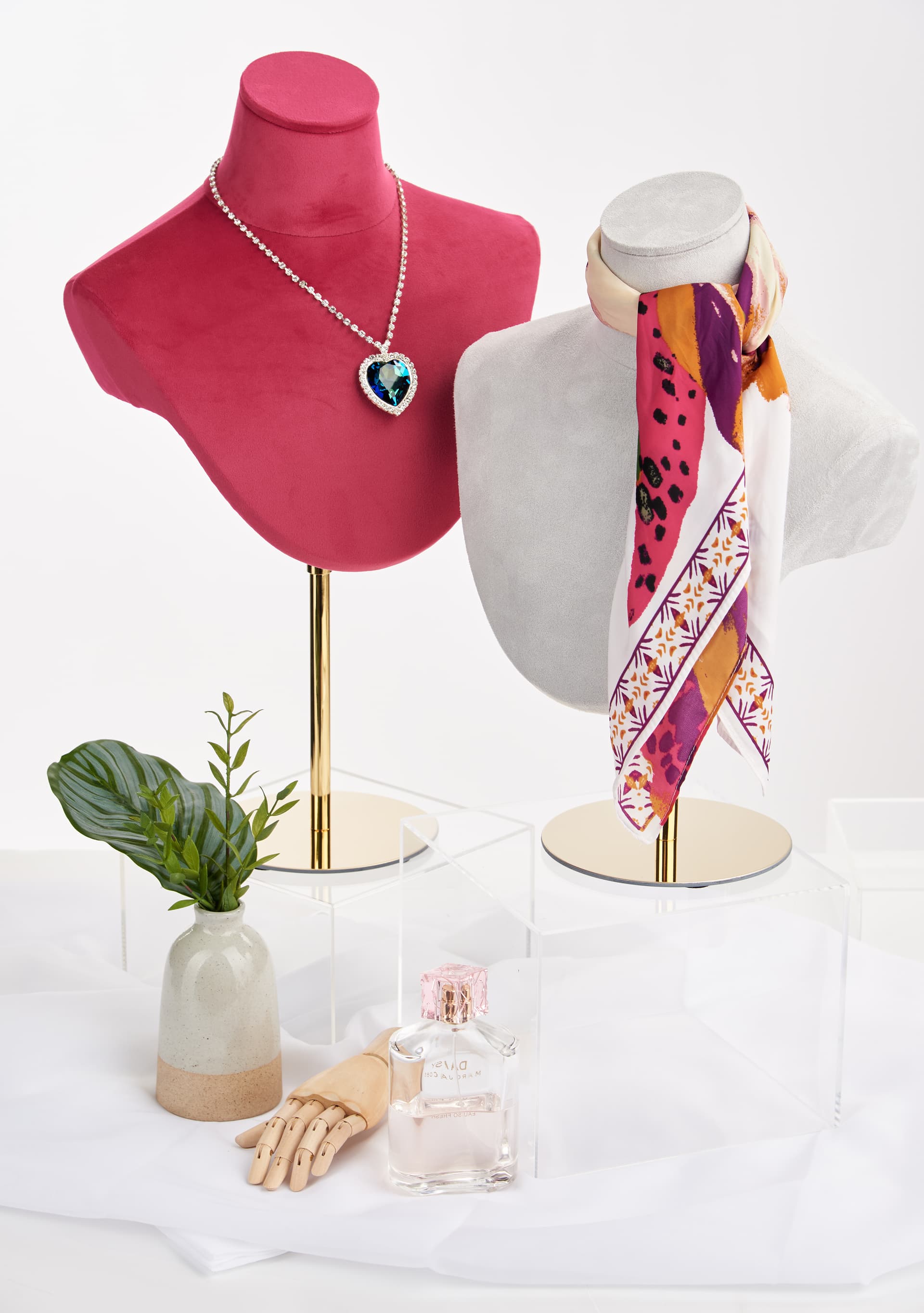 Jewelry bust stand has different height ranges 
