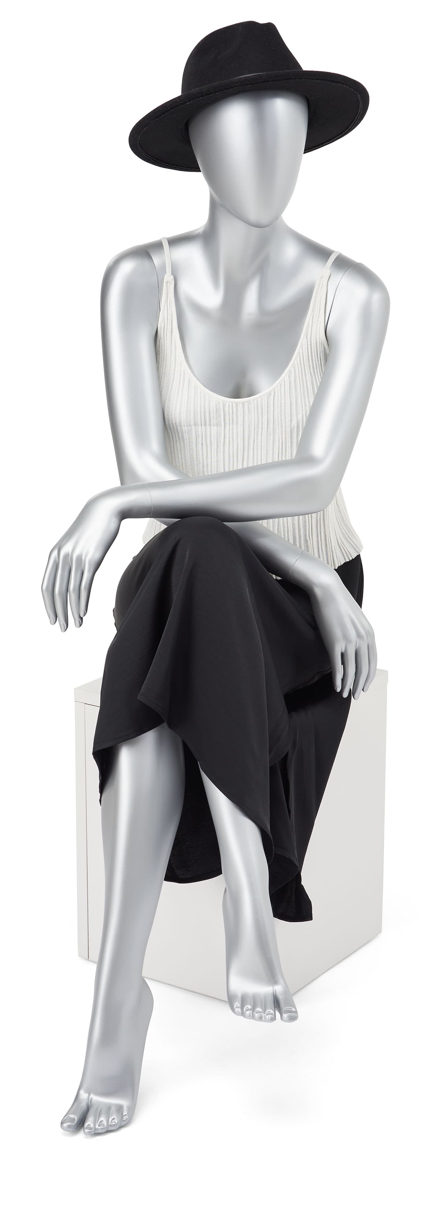Abstract seated female mannequin measures 52 inches tall 