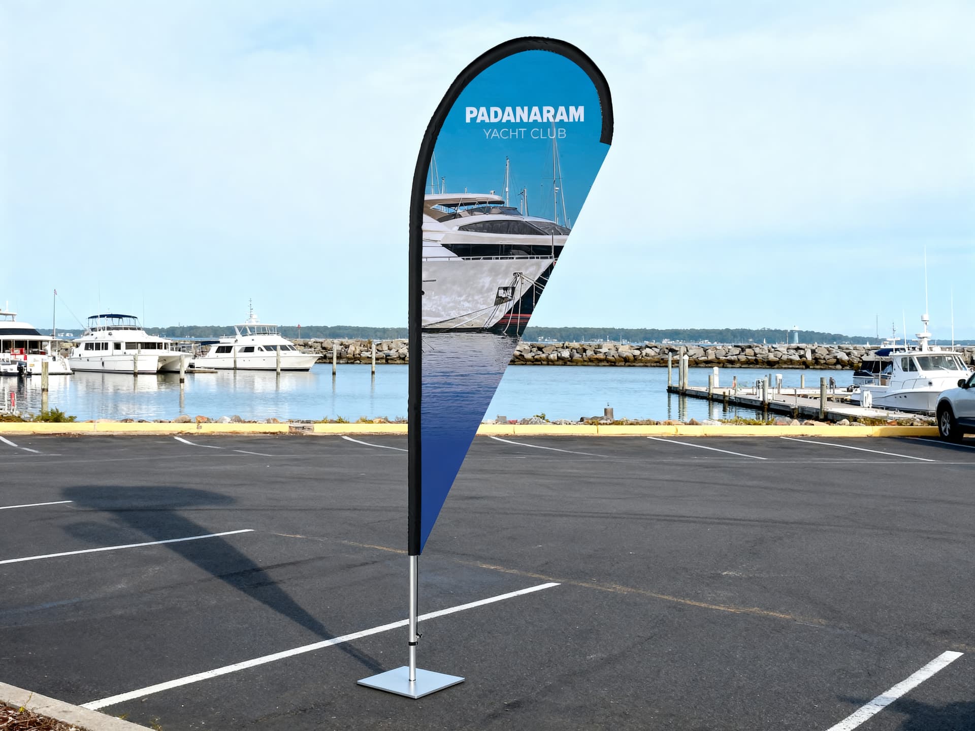Custom Teardrop Flag in a marina parking lot