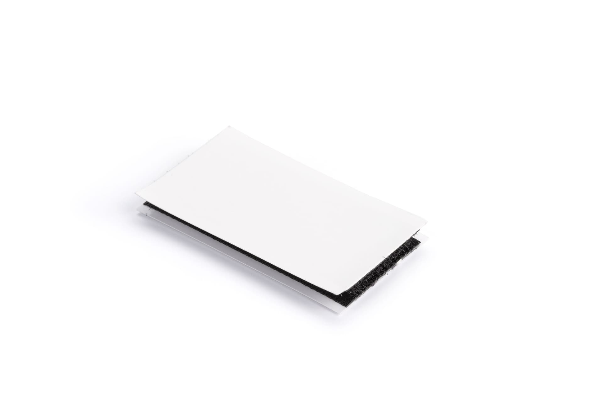 Hook and loop strips with removable film 