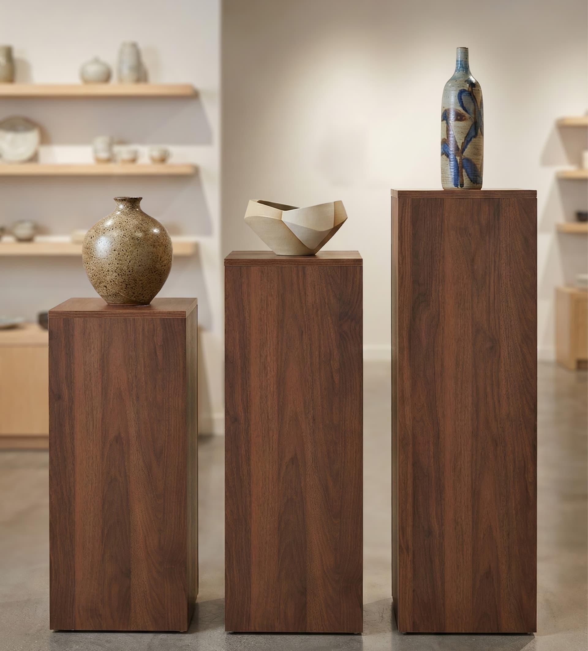 Display riser stand shown paired with 30" and 36" tall pedestals