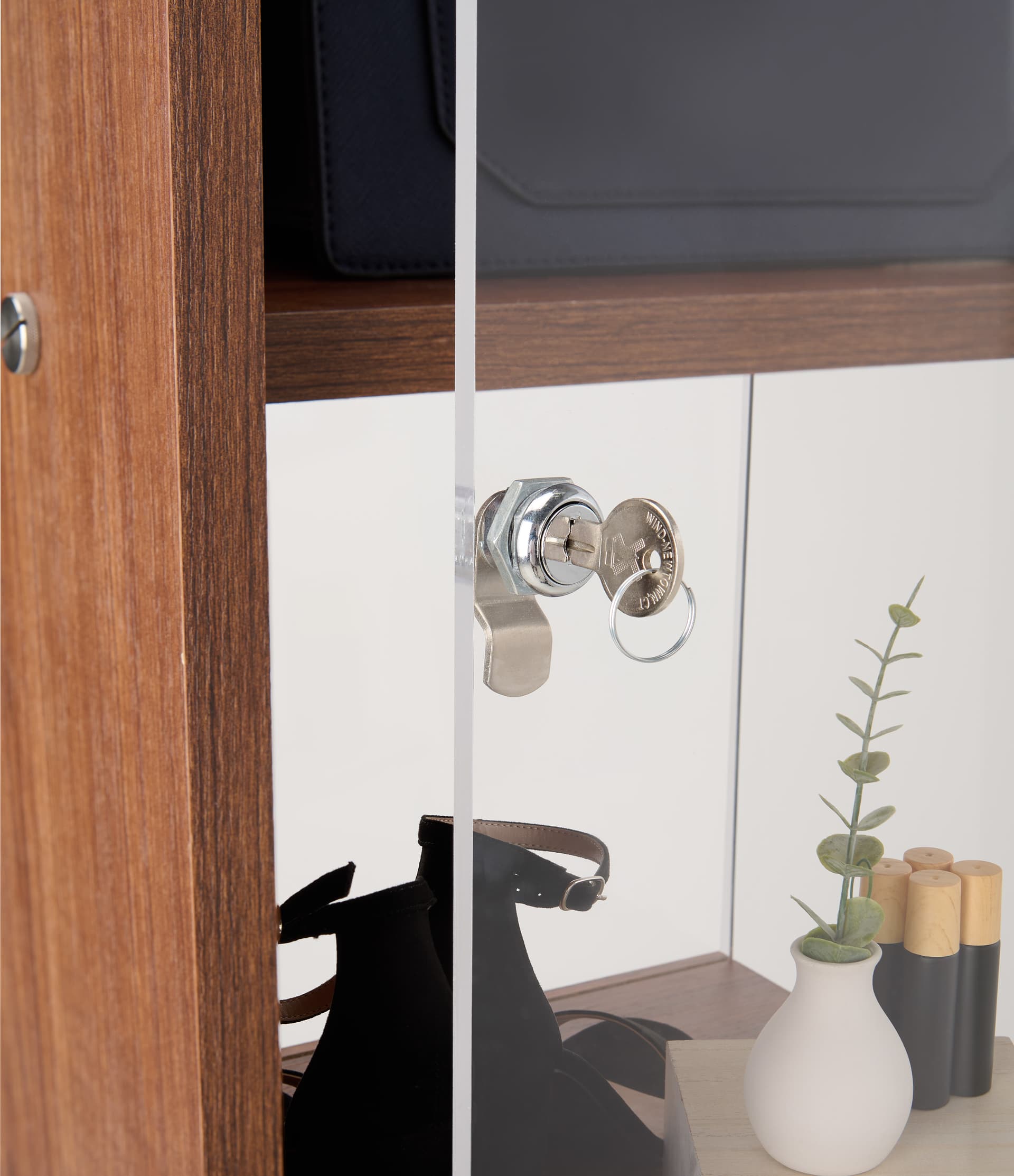 Narrow display case with locking doors