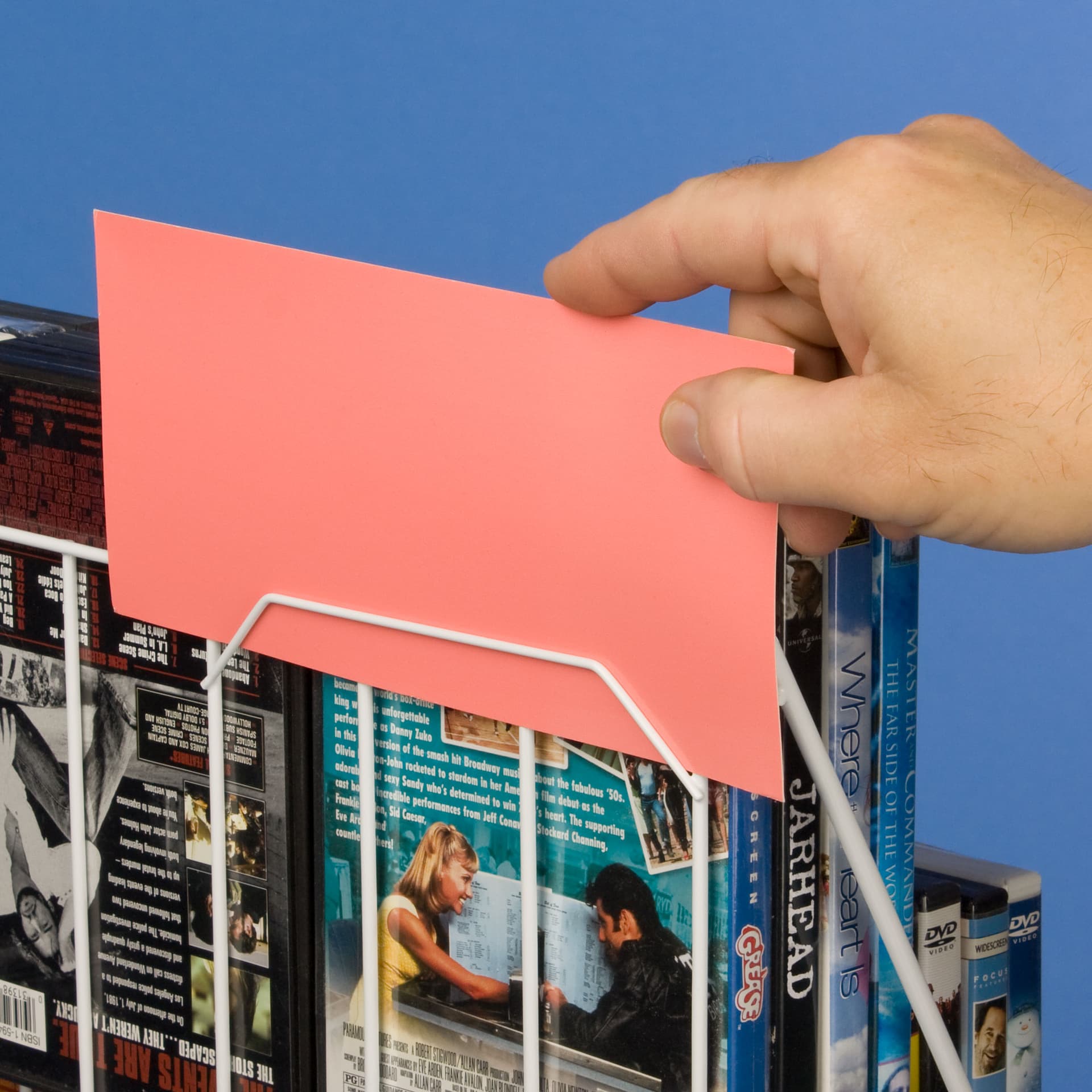 White Wire Magazine Rack that Holds Signage