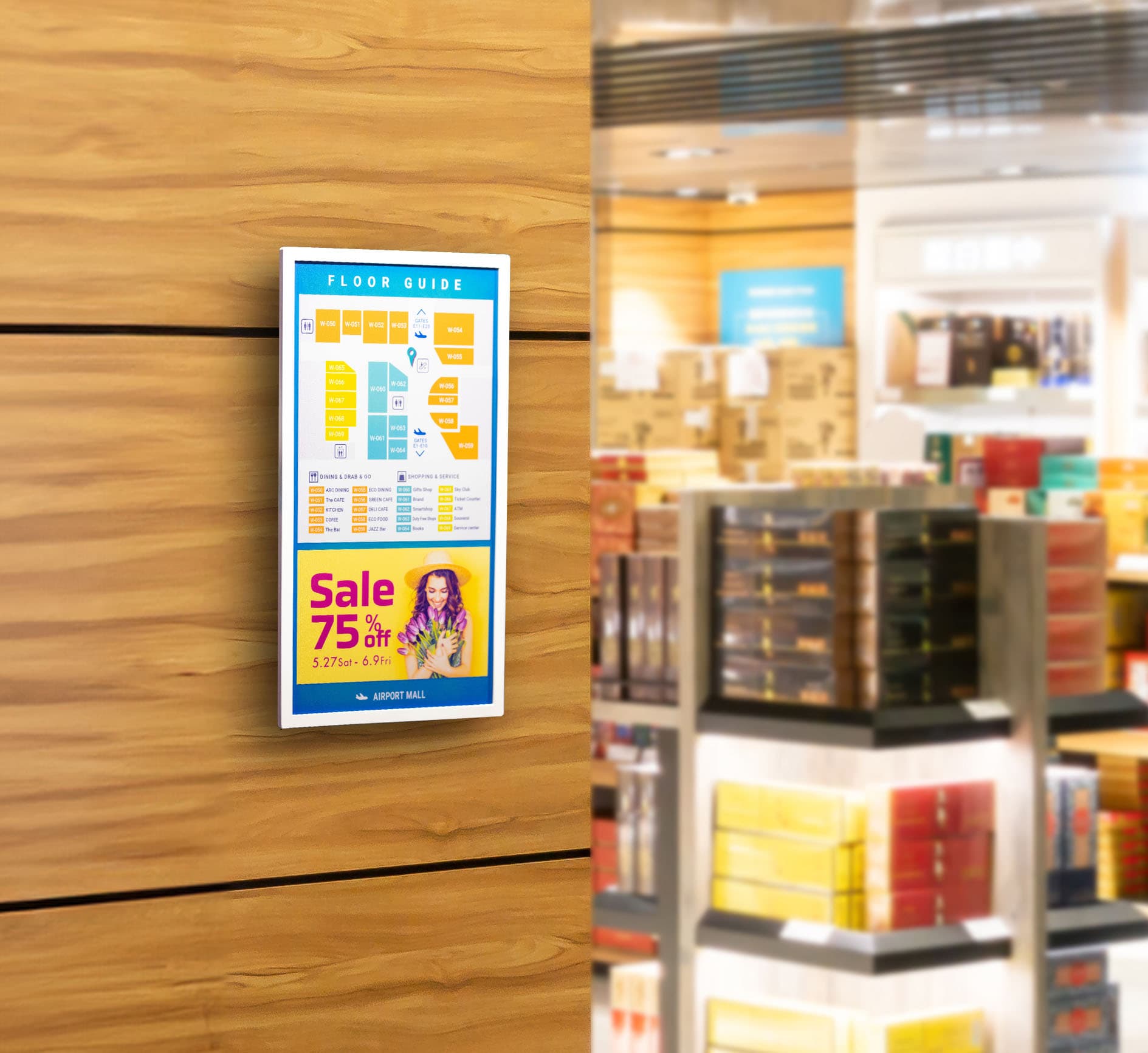 Digital signage ePaper being shown mounted on a wall showing a wayfinding graphic