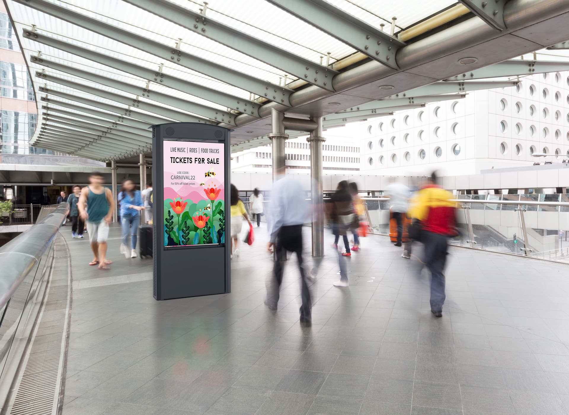 Outdoor digital Kiosk being utilized in a public transit area