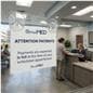 Glass mount sign holder shown at a health provider's lobby