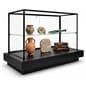 Illuminated display case​ showcasing museum items inside