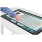 Interactive touch screen table with someone interacting with a graphic of an art museum bio for an artist