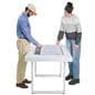 Interactive touch screen table showing two individuals collaborating with the table showing architects plans