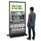 Digital display advertising floor stand with an individual standing next to it to showcase its size of 71 inches in height