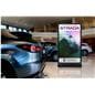 Digital display advertising floor stand being showcased inside a car dealership showroom featuring a video of a car advertisement 