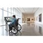 Accessible Touch Screen Table with a man in a wheelchair interacting with it in an art museum