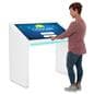 Edge lit horizontal touch screen kiosk with customer interacting with screen