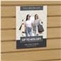 Acrylic gridwall sign holder being shown on a slatwall advertising a clothing sale